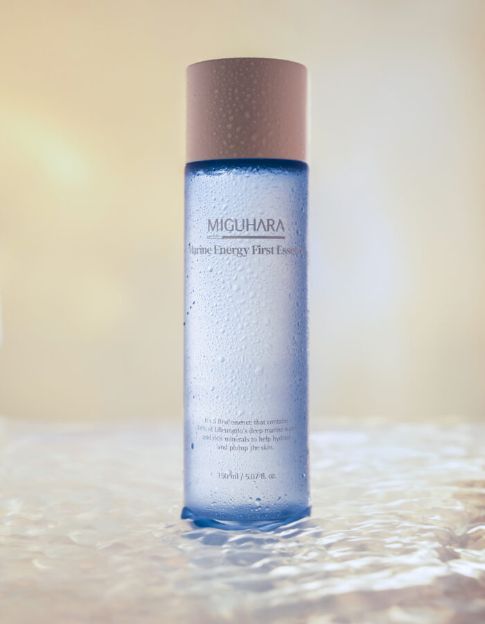 Miguhara Marine Energy First Essence, 150mL, in a sleek, transparent bottle with a marine-inspired design. Formulated with nourishing marine ingredients, this essence is perfect for hydrating and revitalizing the skin as the first step in your skincare routine.