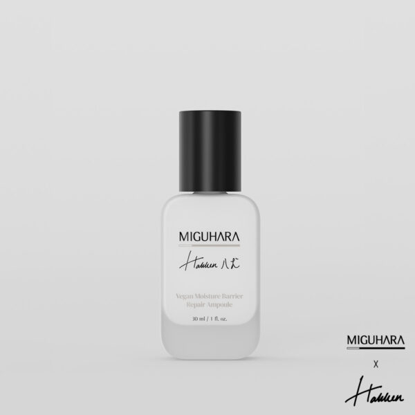 A compact, frosted glass bottle of Miguhara Vegan Moisture Barrier Ampoule, 30mL, featuring a minimalist design with a dropper cap. The ampoule is formulated to strengthen the skin's moisture barrier, providing deep hydration and nourishment for a healthy, radiant complexion.