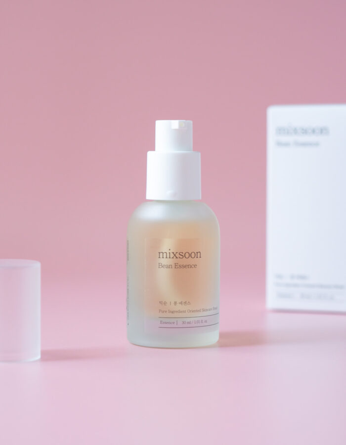 Bottle of Mixsoon - Bean essence 30ml on the pink background