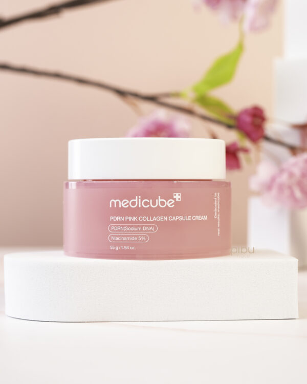 PDRN Pink Collagen Capsule Cream jar on top of white platform