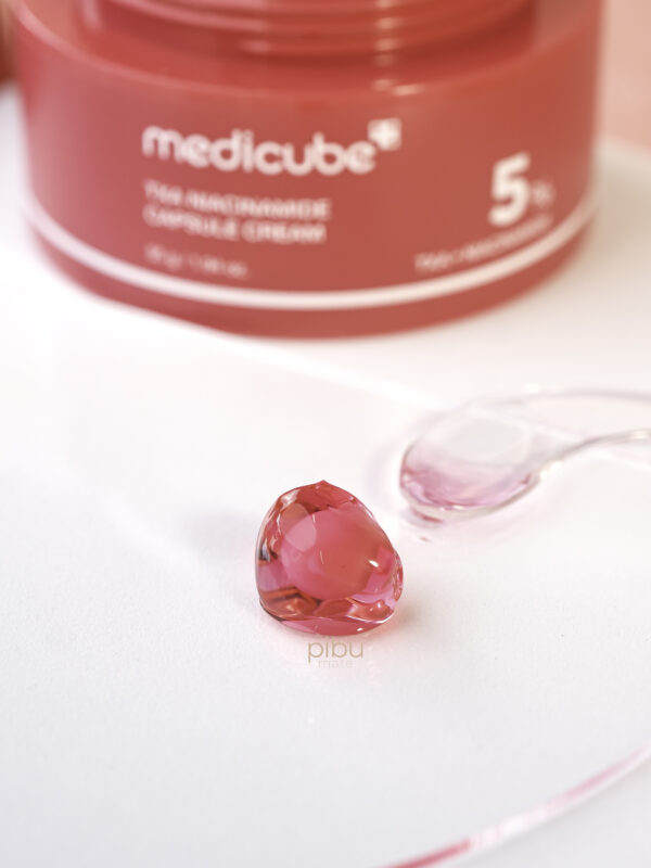 Medicube Niacinamide Capsule Close Up with spatula next to it.