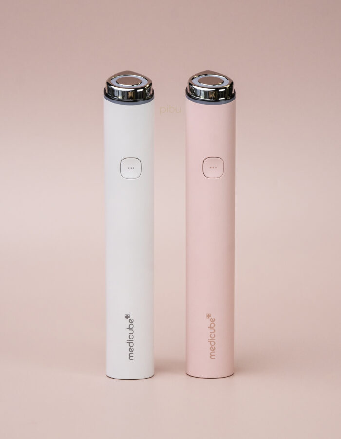 Medicube Age R Booster Pro Mini in white and pink color standing side by side