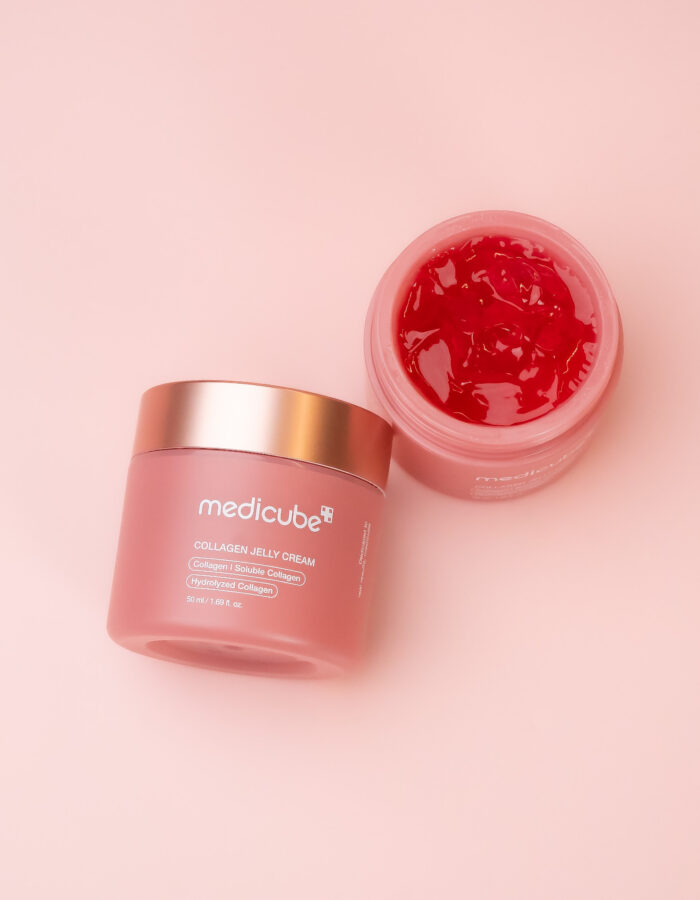 Medicube Collagen Jelly Cream flat lay with open jar on pink background