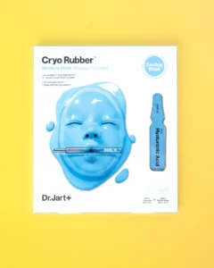 Packaging of Dr. Jart Cryo Rubber Moisturizing Mask featuring a blue rubber mask and hyaluronic acid ampoule on a yellow back